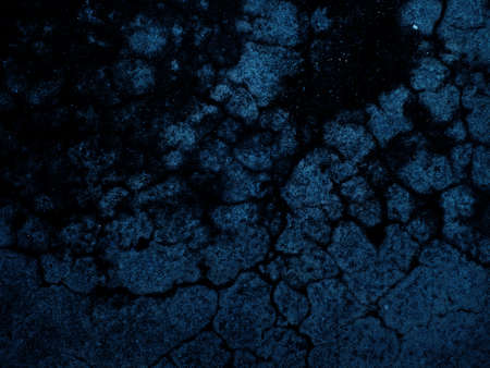 Dark rough cement wall background for graphic design or wallpaper. Grungy black and blue concrete texture in vintage style. The old plaster floor has a mysterious and terrifying age.の写真素材