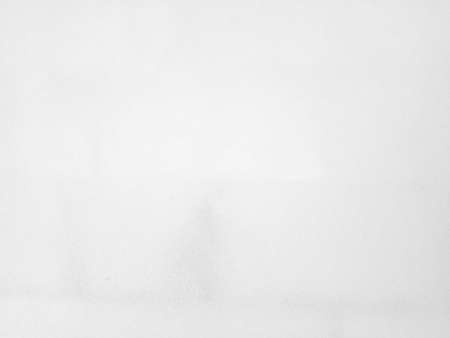 White concrete wall background in vintage style for graphic design or wallpaper. Pattern of soft cement floor in retro concept. Gray abstract texture detail in construction.の写真素材