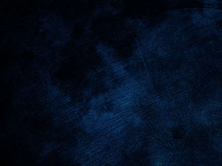 Dark rough cement wall background for graphic design or wallpaper. Grungy black and blue concrete texture in vintage style. The old plaster floor has a mysterious and terrifying age.の写真素材