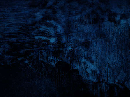 Dark rough cement wall background for graphic design or wallpaper. Grungy black and blue concrete...