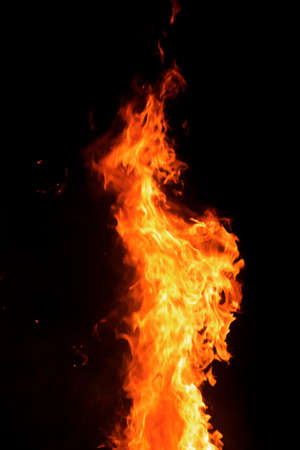 Close up burning flames on black background for graphic design or wallpaper. Red and yellow, heat...