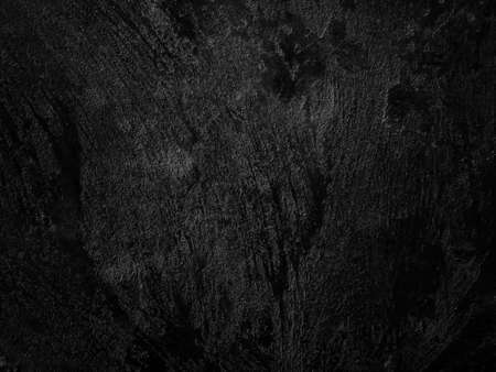 Dark cement wall background in vintage style for graphic design or wallpaper. The pattern of the concrete floor is aged in a retro concept.の写真素材