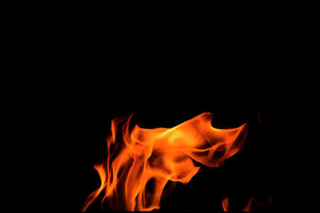 Close up burning flames on black background for graphic design or wallpaper. Red and yellow, heat...