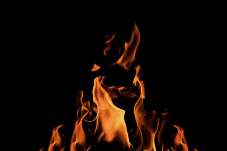 Close up burning flames on black background for graphic design or wallpaper. Red and yellow, heat...