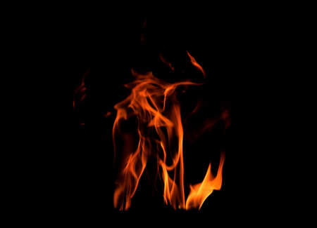 Close up burning flames on black background for graphic design or wallpaper. Red and yellow, heat...