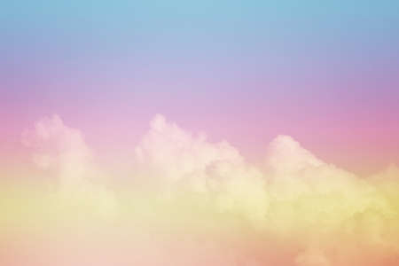 Beautiful sky and clouds in pastel tones. Fluffy soft background in vintage style for graphic design or wallpaper. Colorful natural in the romantic love concept.の写真素材