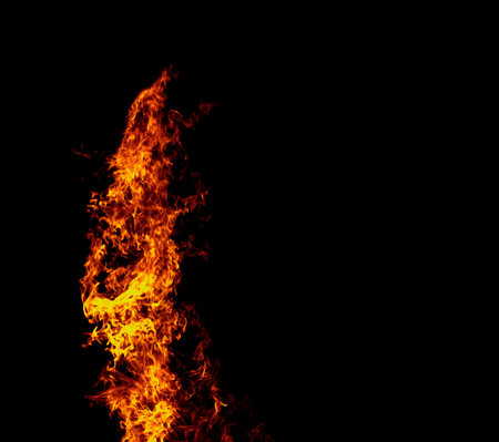 Close up burning flames on black background for graphic design or wallpaper. Red and yellow, heat...