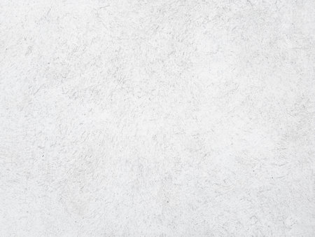 White cement wall background in vintage style for graphic design or wallpaper. Pattern of soft concrete floor in retro concept.の写真素材
