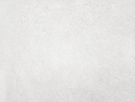 White cement wall background in vintage style for graphic design or wallpaper. Pattern of soft concrete floor in retro concept.の写真素材
