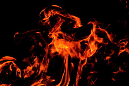 Close up burning flames on black background for graphic design or wallpaper. Red and yellow, heat...