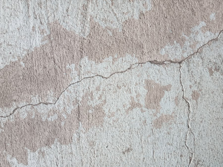 Cracked concrete wall texture, Cement background not painted in vintage style for graphic design or retro wallpaperの写真素材