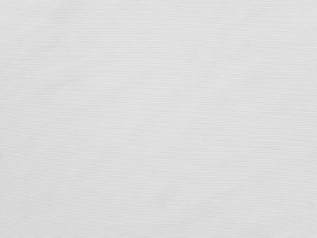 Soft white wrinkled fabric background for graphic design or wallpaper.の写真素材