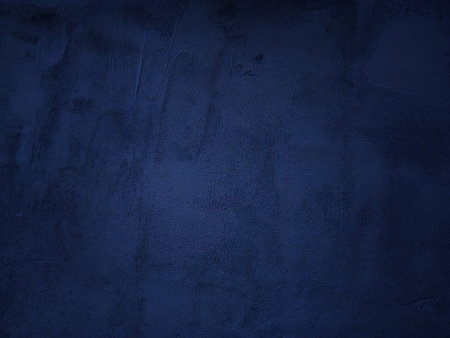 Dark rough cement wall background for graphic design or wallpaper. Grungy black and blue concrete texture in vintage style. The old plaster floor has a mysterious and terrifying age.の写真素材