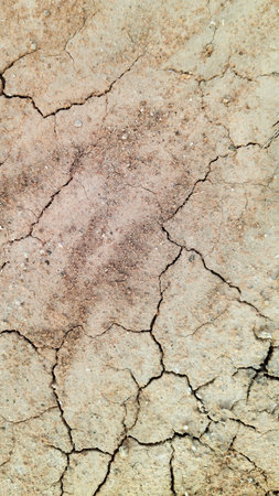 The ground has cracks in the top view for the background or graphic design with the concept of...