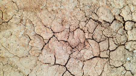 The ground has cracks in the top view for the background or graphic design with the concept of...