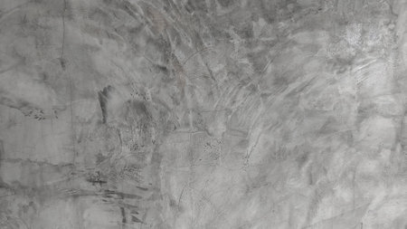 Old cement wall background in vintage style for graphic design or wallpaper. The pattern of the concrete floor is aged in a retro concept. Retro template for presentations or making postcards.の写真素材