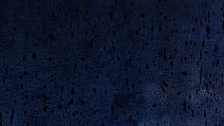 Dark rough cement wall background for graphic design or wallpaper. Grungy black and blue concrete texture in vintage style. The old plaster floor has a mysterious age.の写真素材