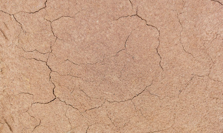 The ground has cracks in the top view for the background or graphic design with the concept of...