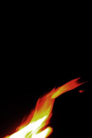 Close up burning flames on black background for graphic design or wallpaper. Red and yellow, heat...