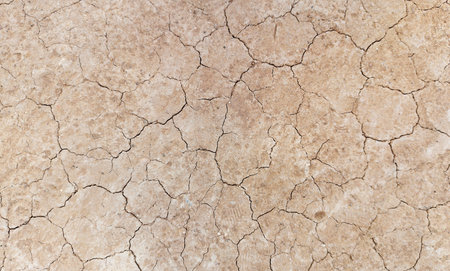 The ground has cracks in the top view for the background or graphic design with the concept of...