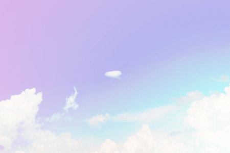 Beautiful sky and clouds in pastel tones. Fluffy soft background in vintage style for graphic design or wallpaper. Colorful natural in the romantic love concept.の写真素材