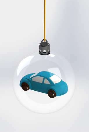 Toy car in glass christmas ballの写真素材