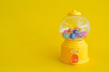 Capsule toy abstract minimal yellow backgroundの写真素材