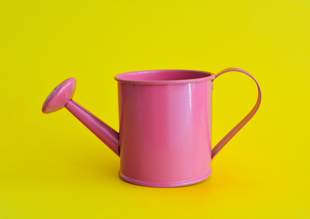 Watering can abstract minimal yellow backgroundの写真素材