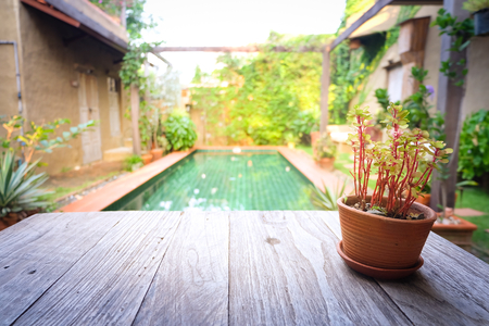 Flowerpot on wooden table, Background for vintage resort hotelの写真素材