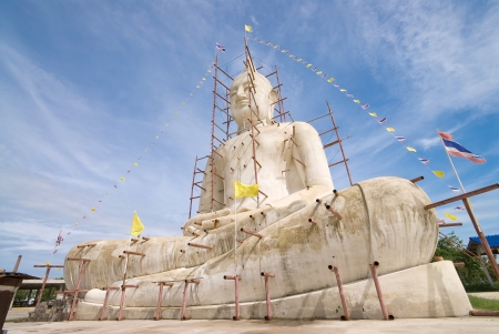 Buddha statue with blue sky and clouds under constructionの写真素材