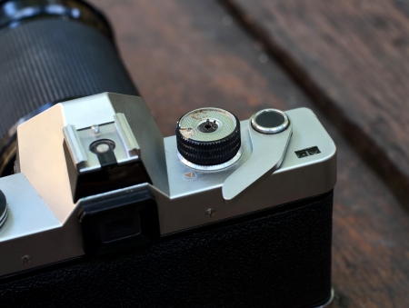old film SLR camera with lens