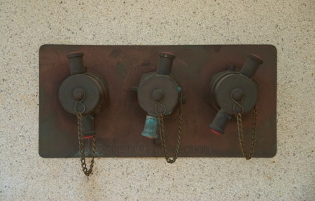 fire department valves on terrazzo wall