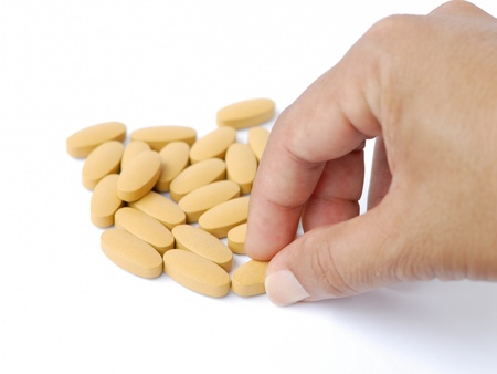 pick the brown pills from the stackの写真素材