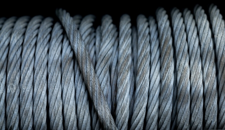 Detail of a big winch winding a steel cableの写真素材