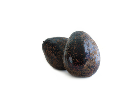 Purple avocado fruit on white background.の写真素材