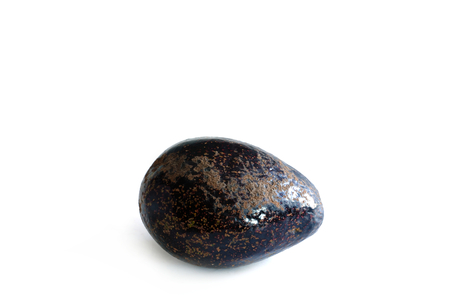 Purple avocado fruit on white background.の写真素材