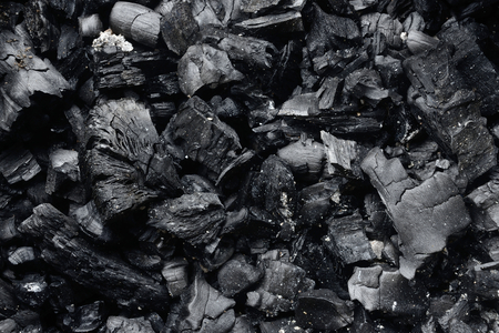 Black charcoal texture closeup for background.