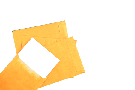 White paper in envelope put on stack isolated on white background.