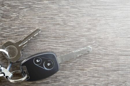 The car keys on wooden floor.