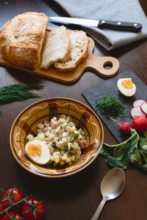 Traditional okroshka soup on kefir with egg and dill