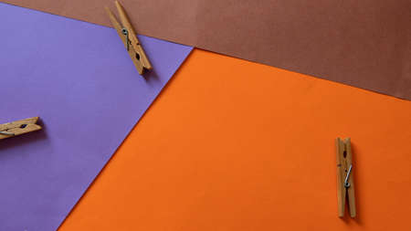 Flat lay concept: colorful clothespin on trendy blue pastel background. Spring or summer is coming concept. View from above. Minimal style with colorful paper backdrop. Washing concept.の写真素材