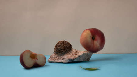 fig Peach balanced on the nature stone