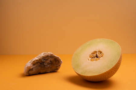 a half of cantaloupe melon on white background the concept of a ripe melon. fruit diet for...