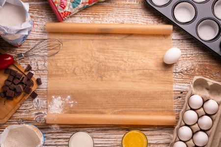 recipe for homemade chocolate muffins. utensils and ingredients for cake preparation. on a white table. ingredients for cupcakesの写真素材
