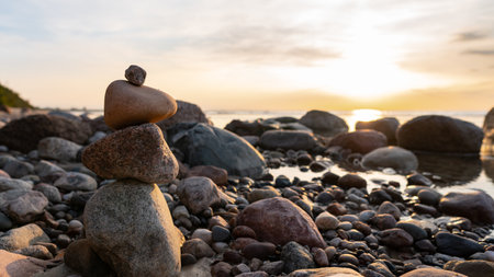 Zen meditation background - balanced stones stack close up on sea beachの写真素材