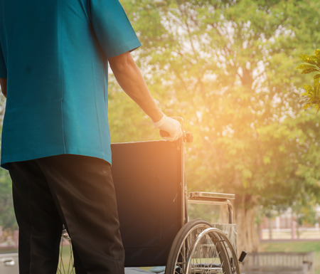 Employees transporting patients waiting patients in a morning's work.Employee stock patients with dexterity, Employees wheelchair patientsの写真素材