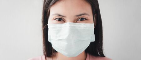 Portraits of Thai women aged 20-30 years wearing masks to prevent infection with the Covid virus....