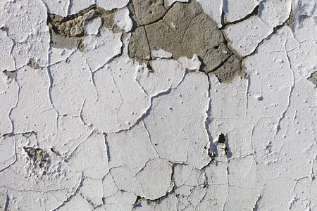 Texture of old stucco wall. Dumps paint and plaster. Bright sunlightの写真素材