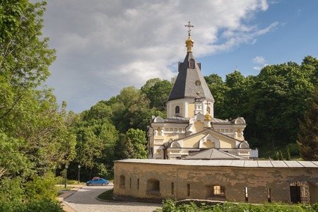Church Life-giving Spring in the Kyiv-Pechersk Lavra. Summer sunny day. Green leaves on treesの写真素材