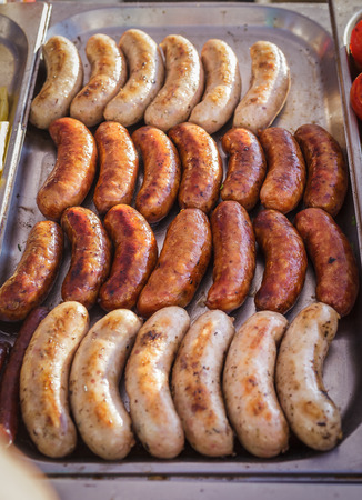 Sausages laid out on a baking sheet. Street food, grillの写真素材